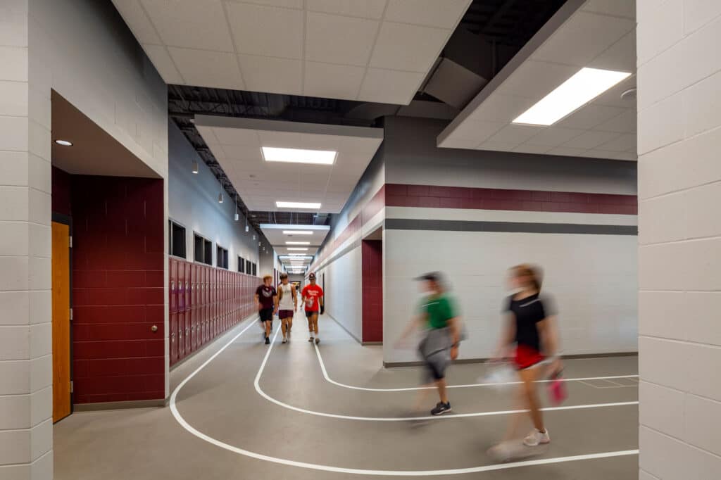 Holmen SD High School people using indoor track built into hallway