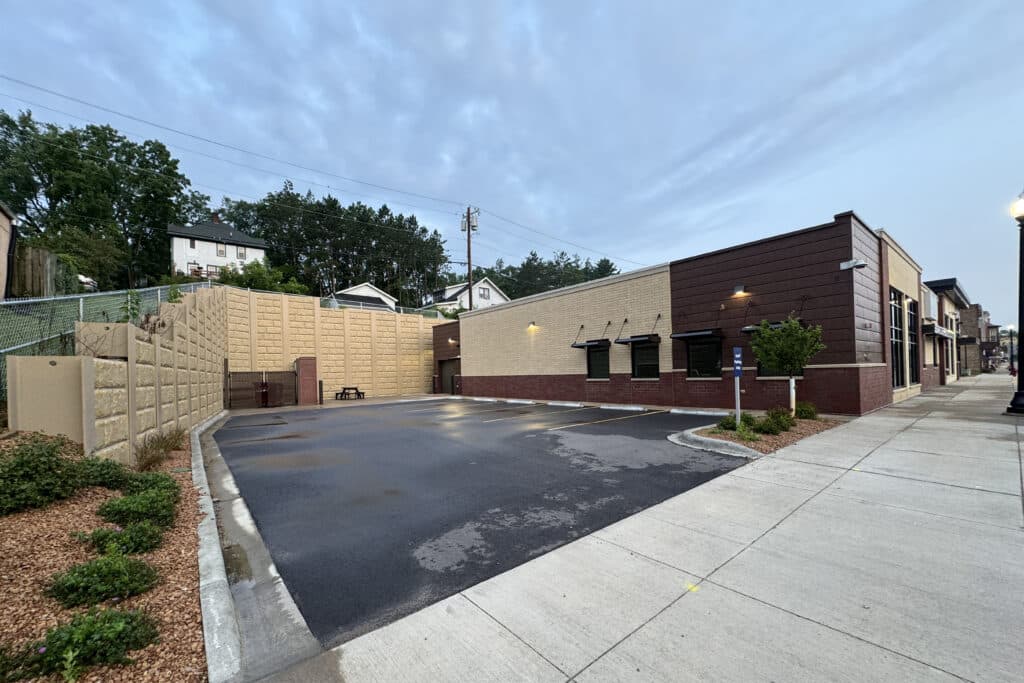 Exterior view of back side entrance and parking area of Elroy Clinic designed by HSR