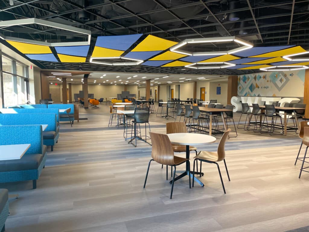HSR interior dining renovation showing ample natural light from large exterior windows and colorful design elements
