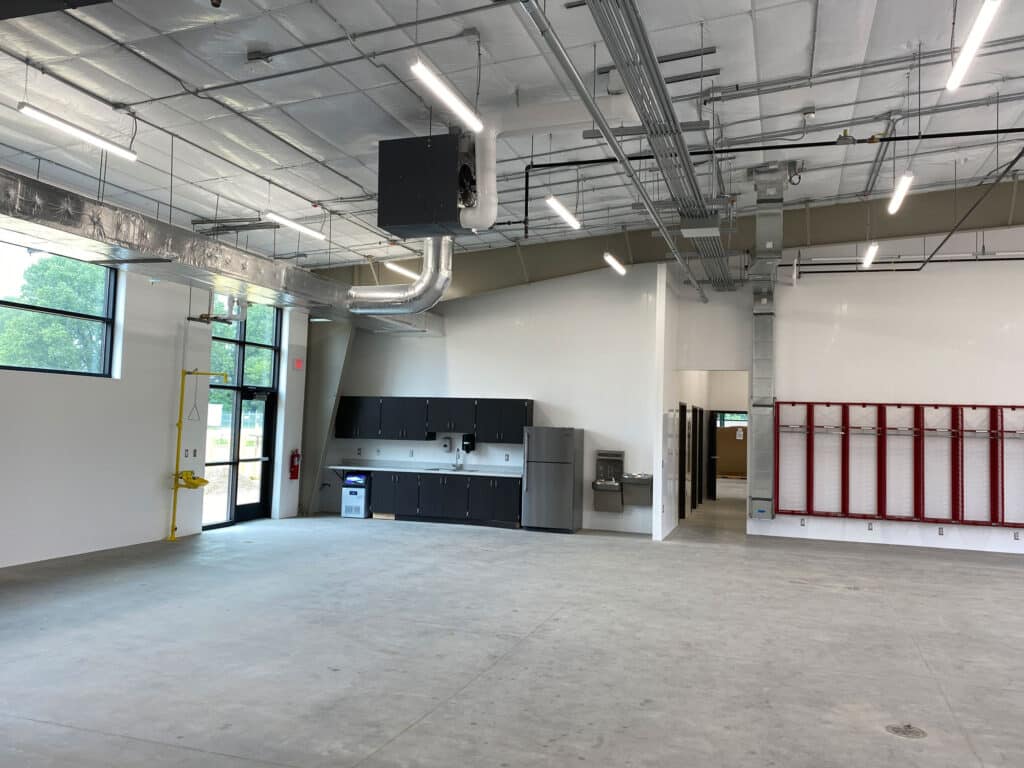 WI DNR Joint Operations Center interior garage bay with cabinets and open lockers