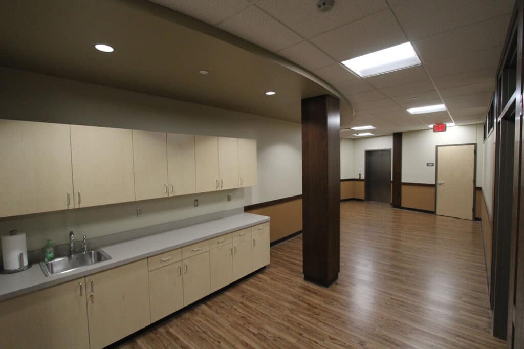 MMOC Lower Level Education Center Hallway with Storage and Sink