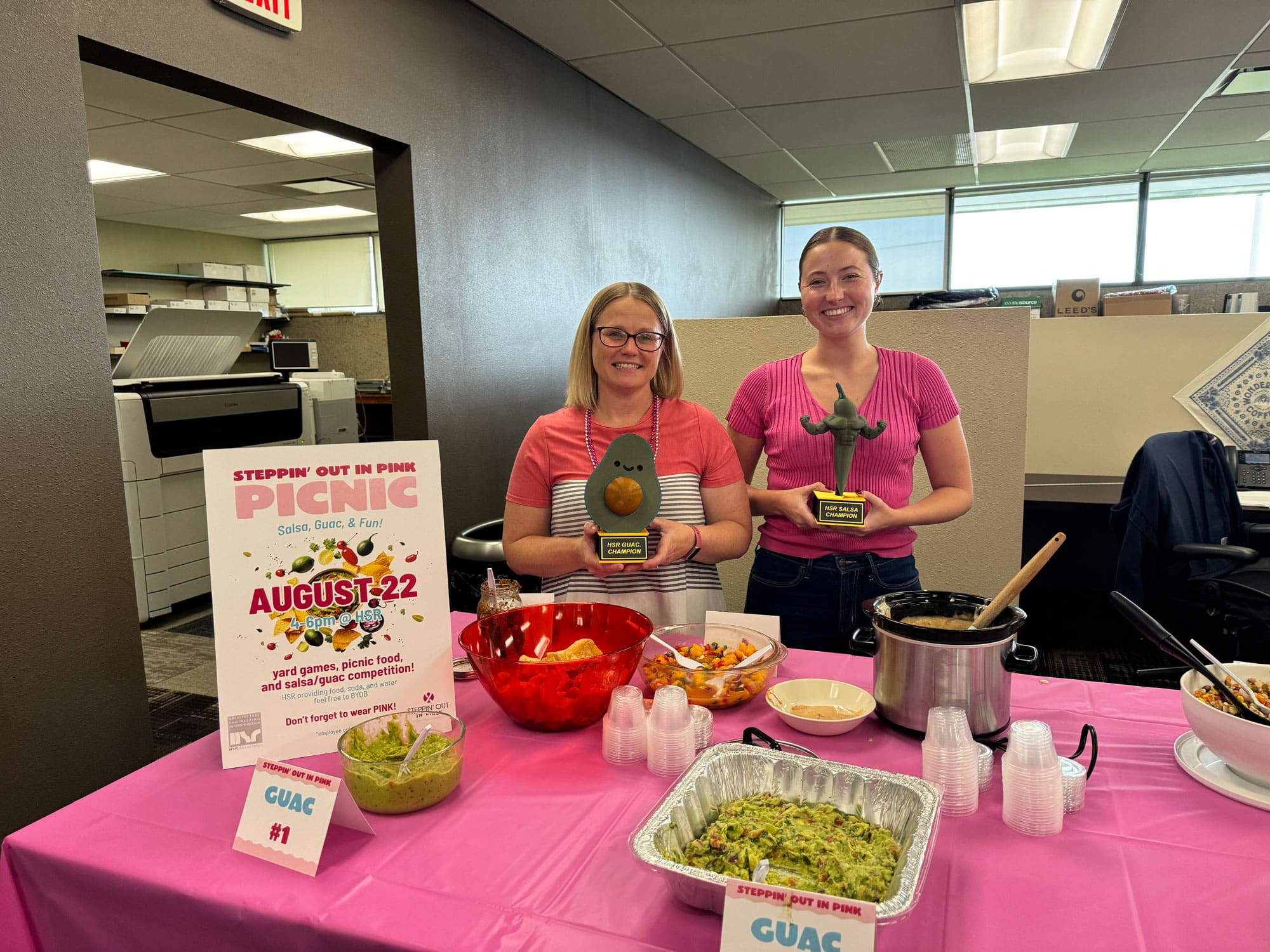 Salsa-Guaq-Competition Two employees with awards for a cooking competition