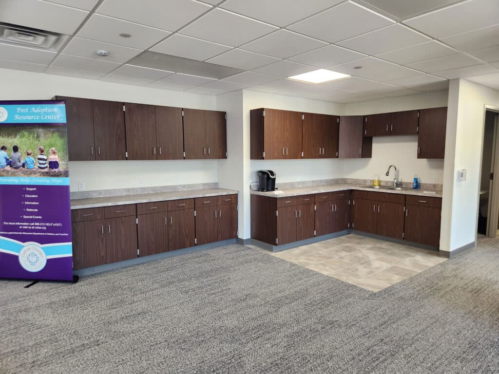 Meeting room with sink and counters in Sojourner House